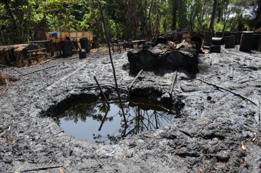 Locally built illegal oil refineries operated by oil thieves in Bayelsa State of Niger Delta on April 11, 2013. Shell has shut a key oil pipeline in southern Nigeria to repair damage caused by oil thieves, leading to a cut of around 150,000 barrels per day, the company said Wednesday in a statement.