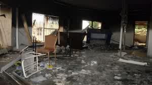 Glass, debris and overturned furniture in one of the rooms at the US embassy attacked in Libya