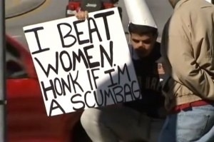 Man Allowed To Hold ‘I Beat Women’ Sign In Street Instead Of Victim Pressing charges