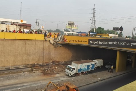 Photos: Sand truck tumbles over bridge onto Express Lane below at Maryland, Lagos