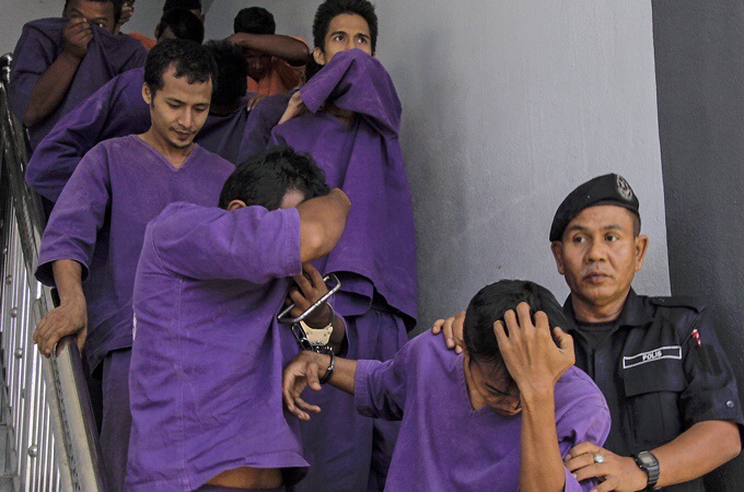 Police detain 13 men after reports that a girl was raped by 38 men in Malaysia