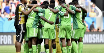 Nigeria players form a team huddle after the World Cup round of 16 soccer match between France and Nigeria at the Estadio Nacional in Brasilia, Brazil, Monday, June 30, 2014. France won the match 2-0. (AP Photo/Martin Meissner)