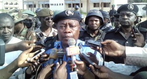Adelere Shinaba, police commissioner for Kano state, speaks to reporters outside the Federal College of Education in the northern Nigerian city of Kano, on September 17, 2014 (AFP Photo/Aminu Abubakar) 