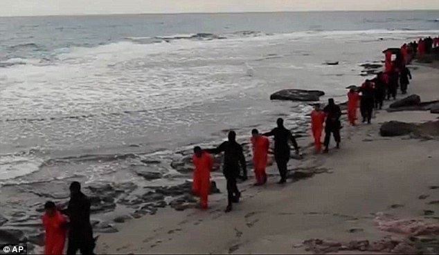 Experts believe that the scene of ISIS terrorists marching 21 Coptic Christians to their death was faked 