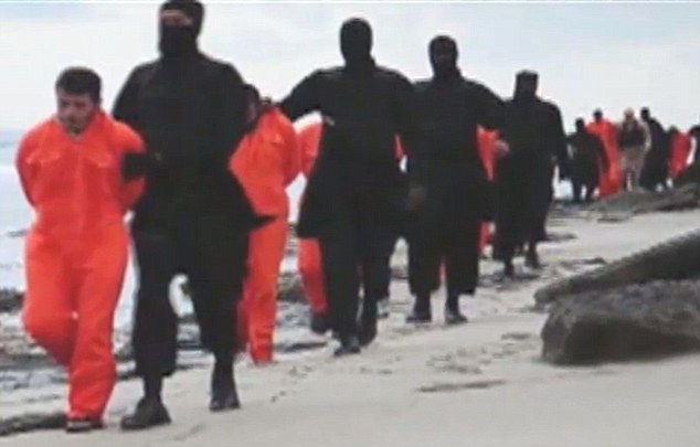 Doctored? The executioners appear to be seven-foot tall in this still taken from the sickening footage