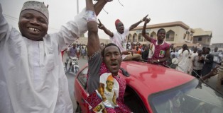 Supporters of opposition candidate Muhammadu Buhari celebrate an anticipated win for their candidate, in Kano, Nigeria Tuesday, March 31, 2015. Nigeria's aviation minister says President Goodluck Jonathan has called challenger Muhammadu Buhari to concede and congratulate him on his electoral victory, paving the way for a peaceful transfer of power in Africa's richest and most populous nation. (AP Photo/Ben Curtis)