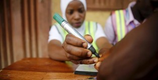 An electoral officer marks the thumb of a voter with ink at the start of voting during the governorship election in Epe district in Nigeria's commercial capital Lagos, April 11, 2015.
Reuters/Akintunde Akinleye